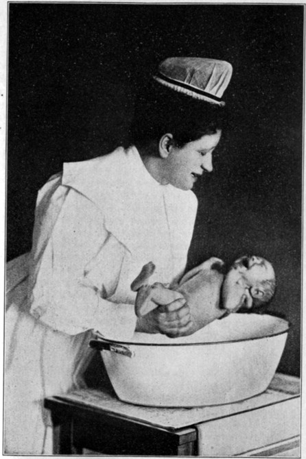 Fig. 13. Supporting the Baby for the Bath.