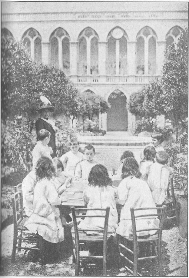 THE CLOISTER SCHOOL OF THE FRANCISCAN NUNS IN ROME
Children playing a game with tablets of coloured silk