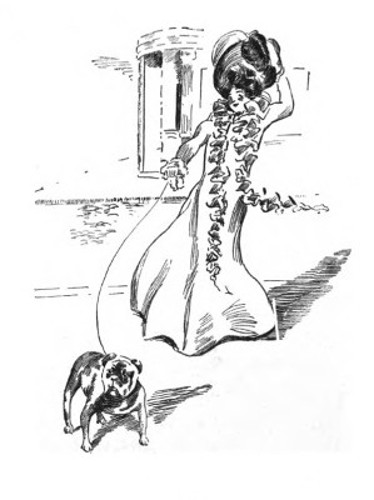 pretty young woman walking a bulldog on a leash