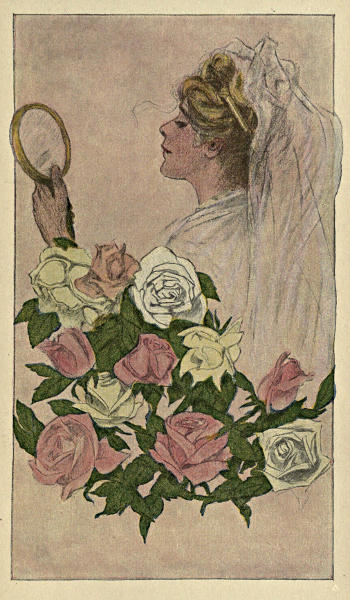 A bride admiring herself in a hand-mirror