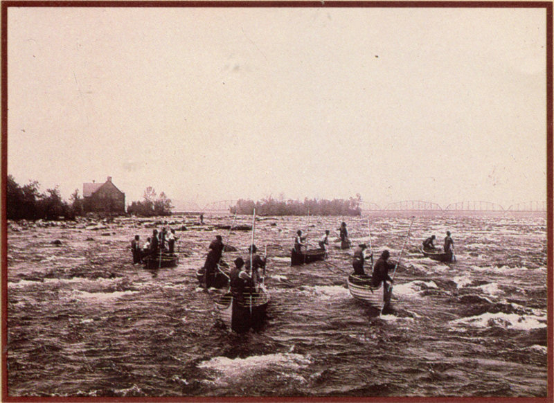 Canoes crossing the river